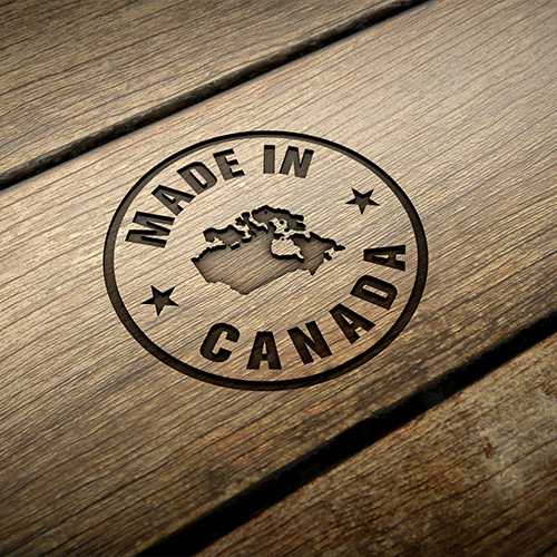 A "Made in Canada" stamp on a wooden surface.