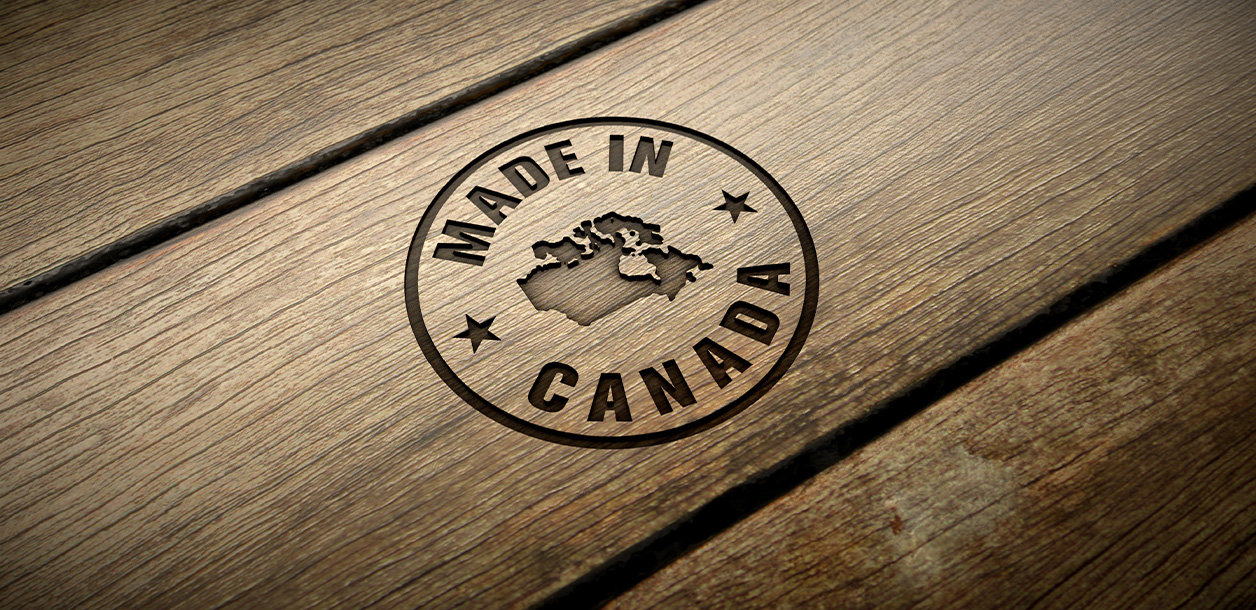 A "Made in Canada" stamp on a wooden surface.